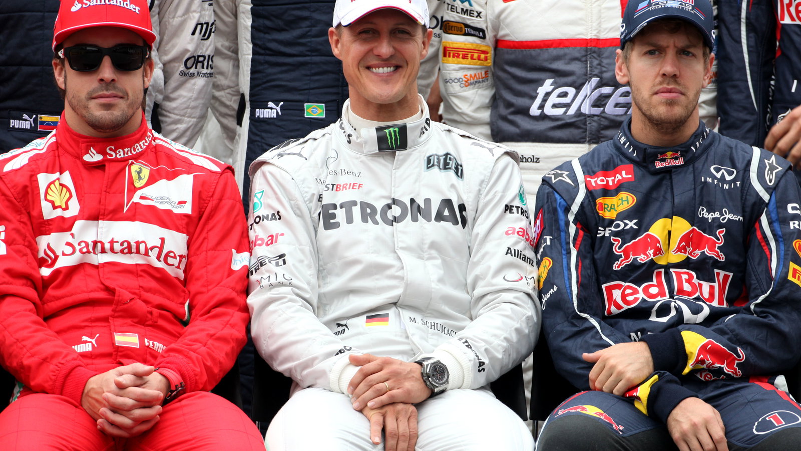 Fernando Alonso alongside Michael Schumacher and Sebastian Vettel.