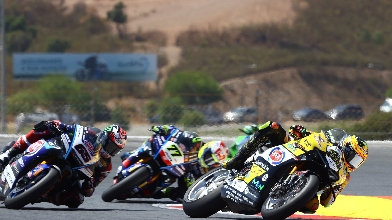 Andrea Iannone leads Jonathan Rea, Dominique Aegerter, 2024 Portuguese WorldSBK. Credit: Gold and Goose.