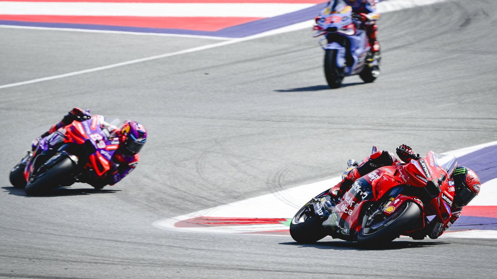 Francesco Bagnaia leads Jorge Martin, Marc Marquez, 2024 MotoGP Austrian Grand Prix, Sprint. Credit: Gold and Goose.