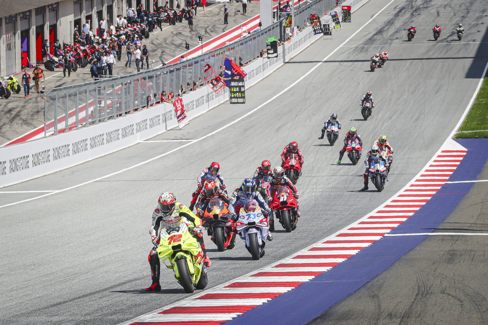 Marco Bezzecchi leads MotoGP group, 2024 MotoGP Austrian Grand Prix. Credit: Gold and Goose.