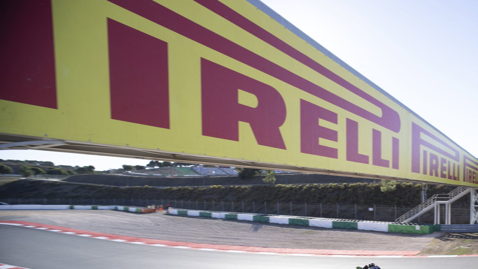 Alex Lowes passes under a Pirelli-badged gantry, 2024 Portuguese WorldSBK. Credit: Gold and Goose.