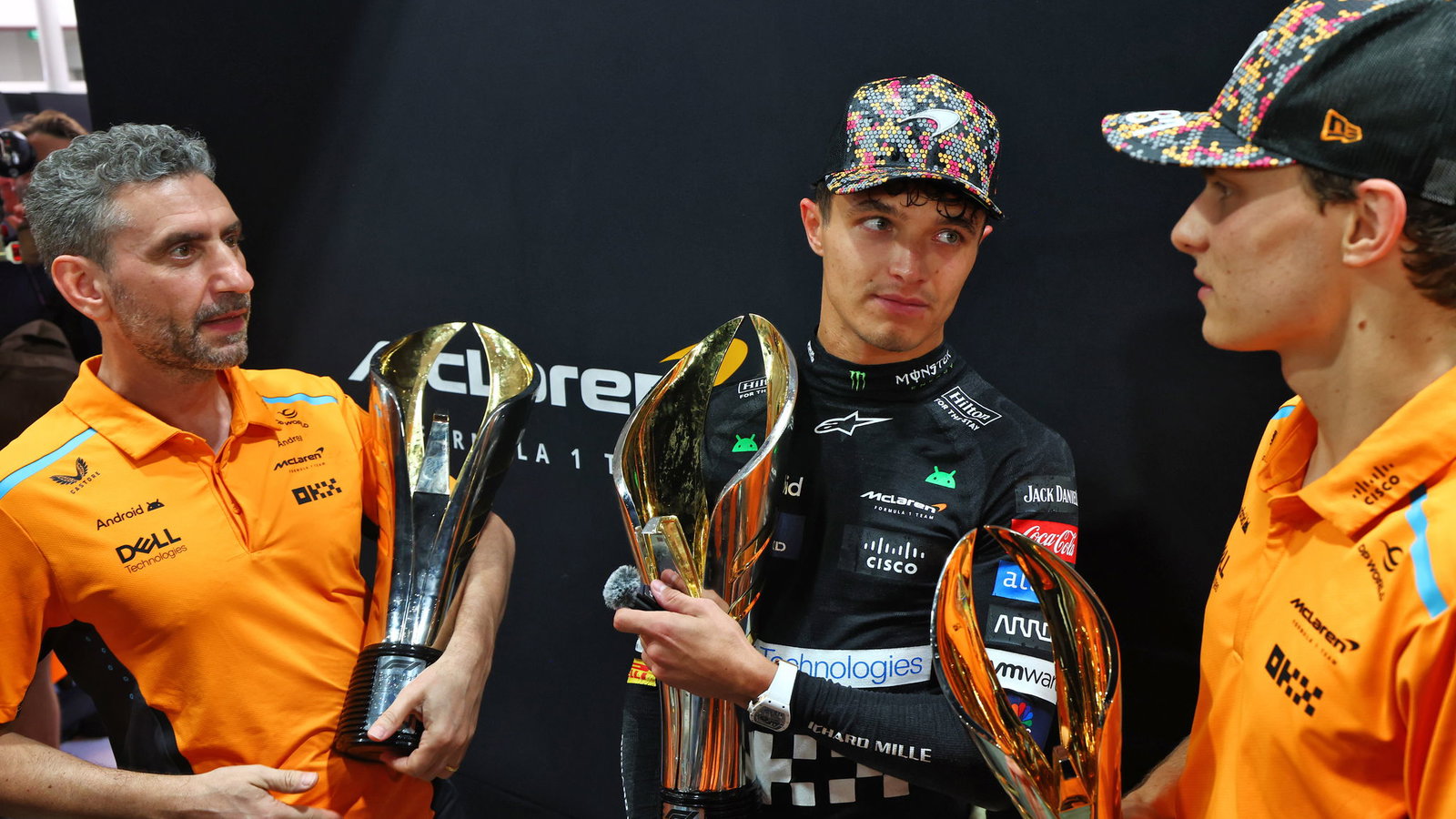McLaren's Andrea Stella and drivers Lando Norris and Oscar Piastri