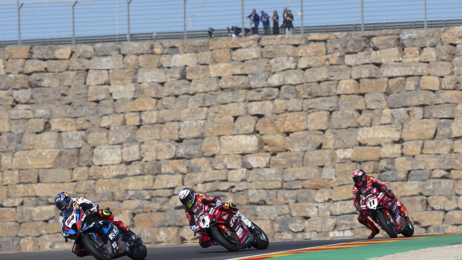 Toprak Razgatlioglu leads Alvaro Bautista, Nicolo Bulega, 2024 Aragon WorldSBK. - Gold and Goose.