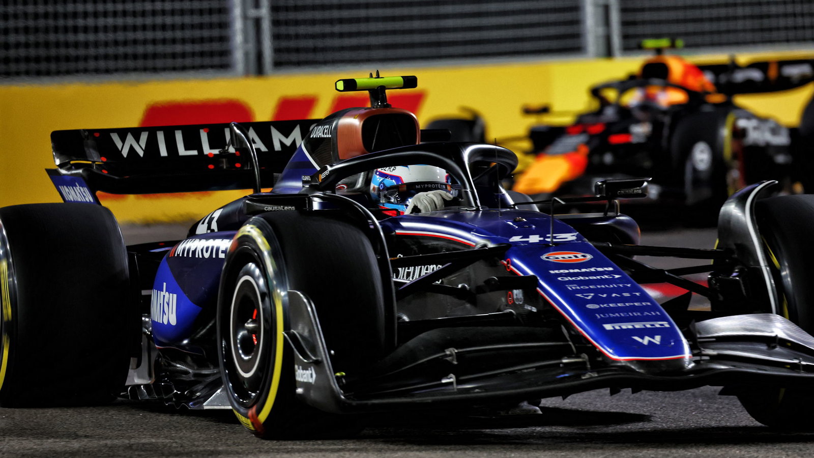 Franco Colapinto leads Sergio Perez in Singapore