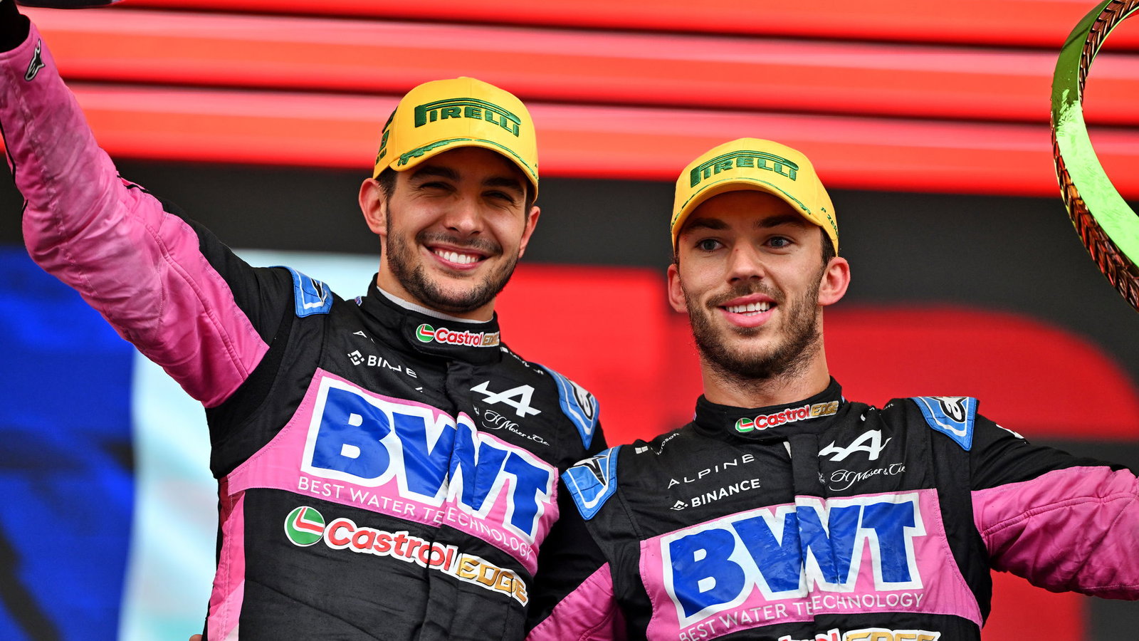 Esteban Ocon and Pierre Gasly celebrate on the podium