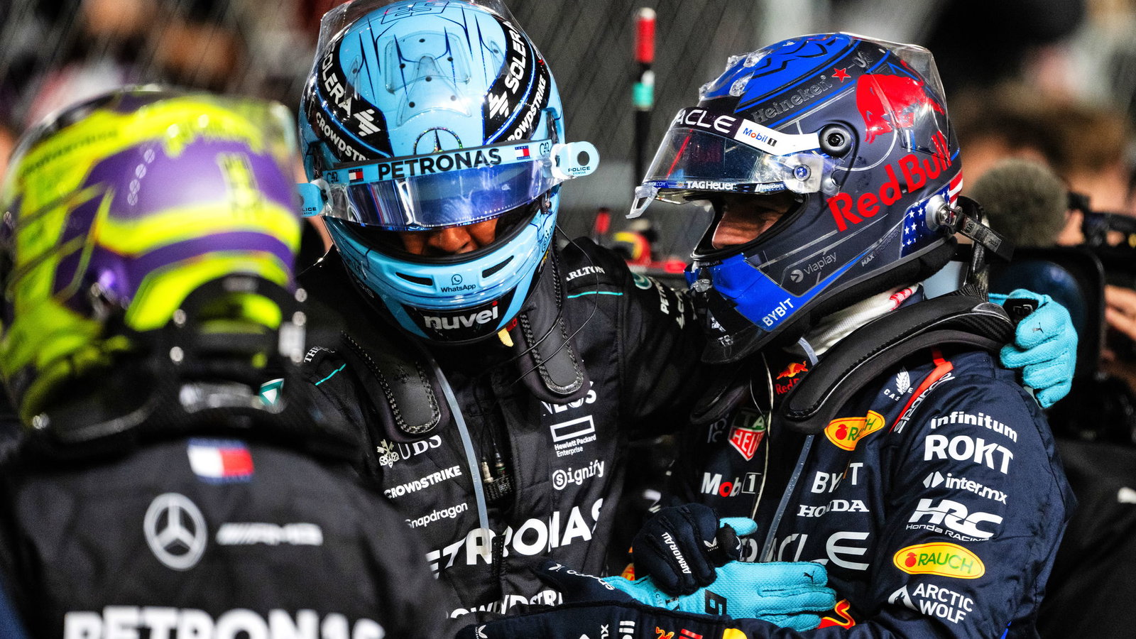 George Russell congratulates Max Verstappen on title number four