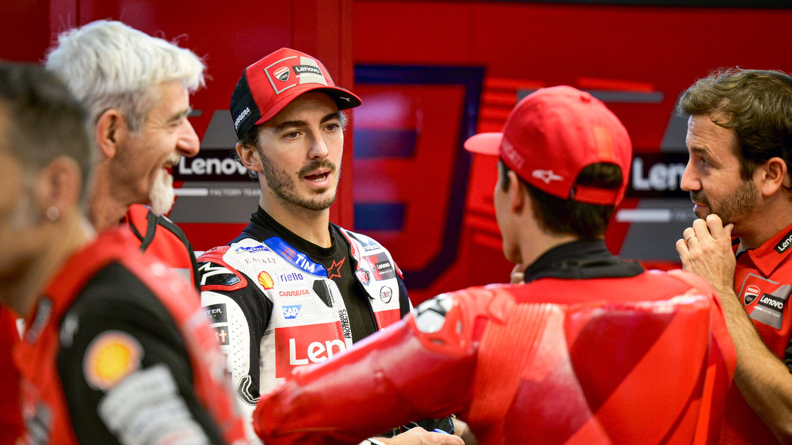 Francesco Bagnaia, Gigi Dall'Igna, Marc Marquez, 2024 MotoGP Barcelona Test, pit box. Credit: Gold and Goose
