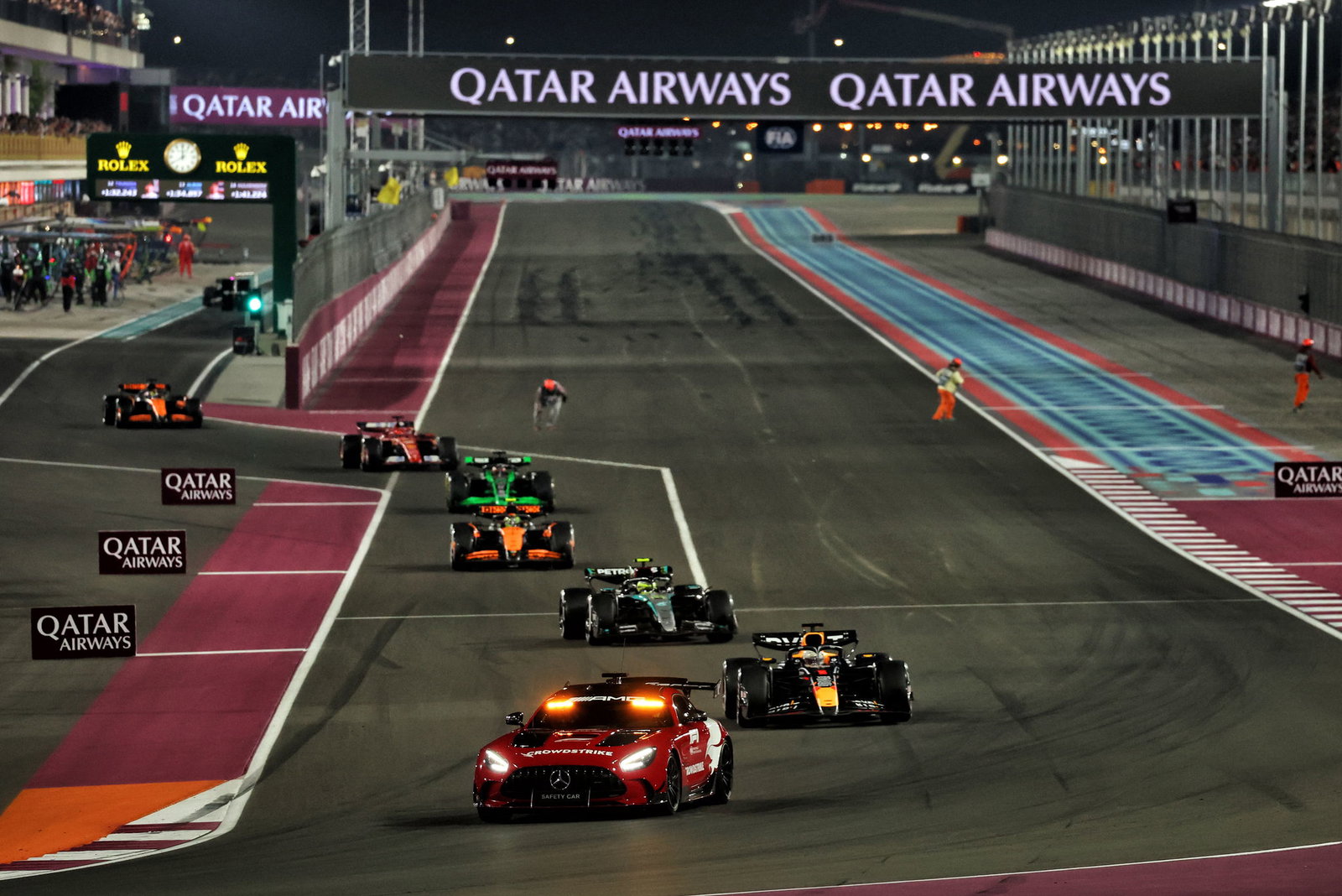 Max Verstappen leads the pack under the Safety Car