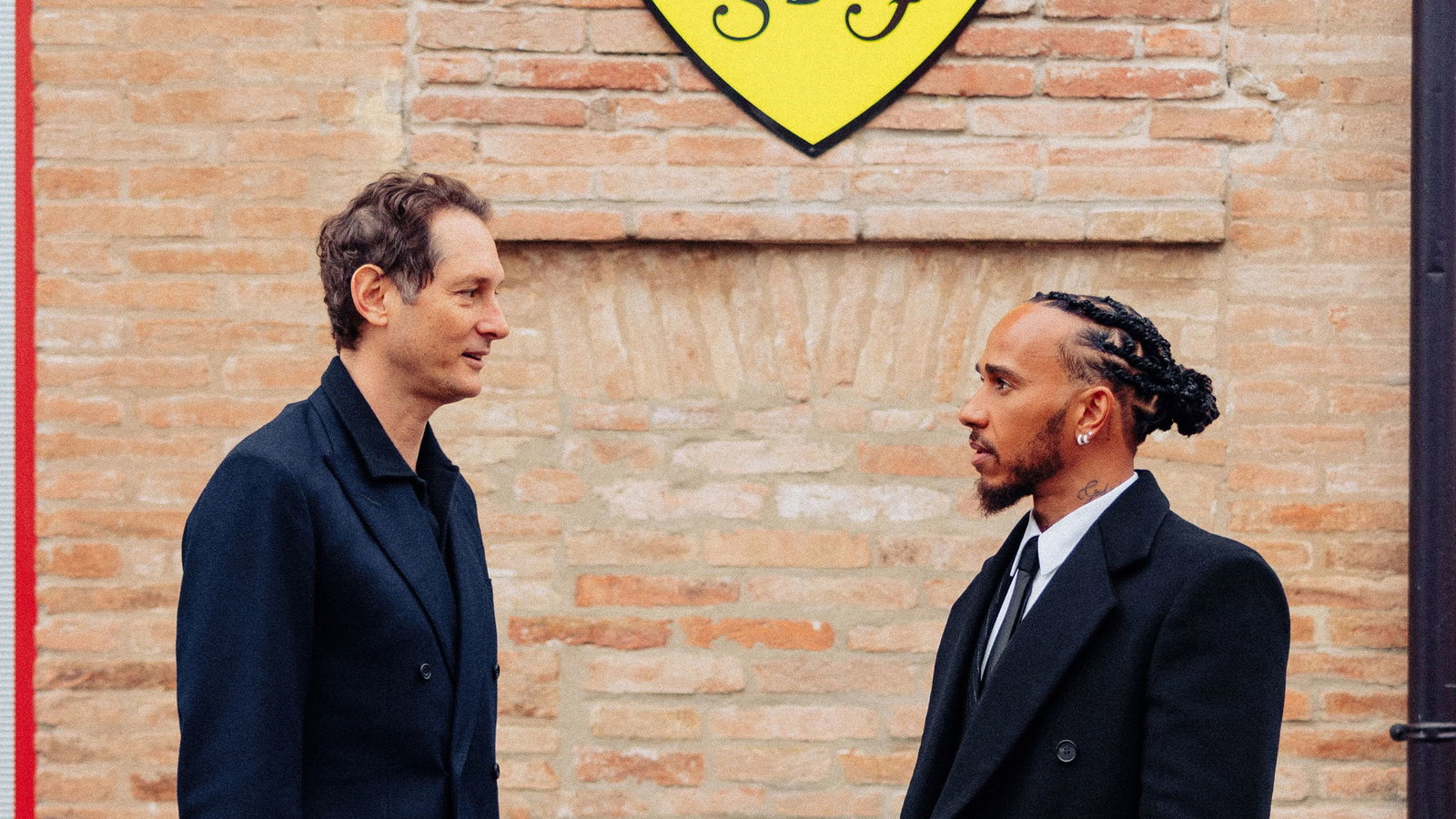 Ferrari chairman John Elkann and Lewis Hamilton 