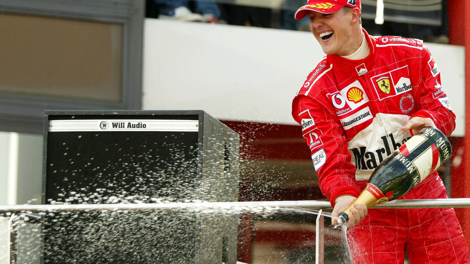Michael Schumacher celebrates winning his seventh drivers' title in 2004