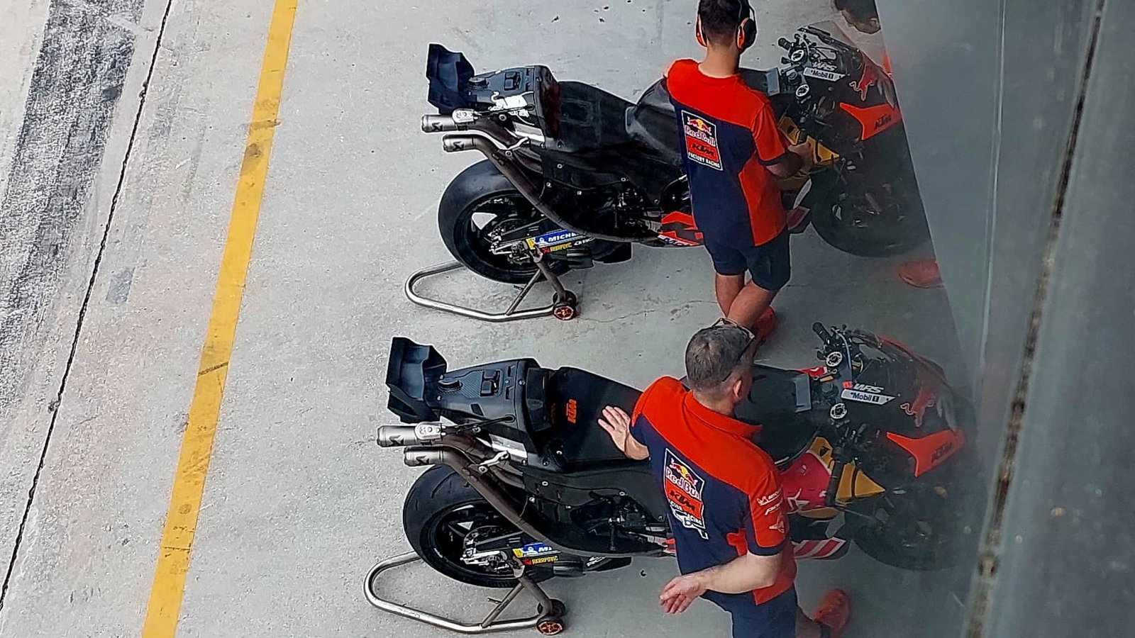Dani Pedrosa's KTMs, featuring the revised 'salad box' and exhaust location, are warmed up ahead of day 3 at the Sepang Shakedown.