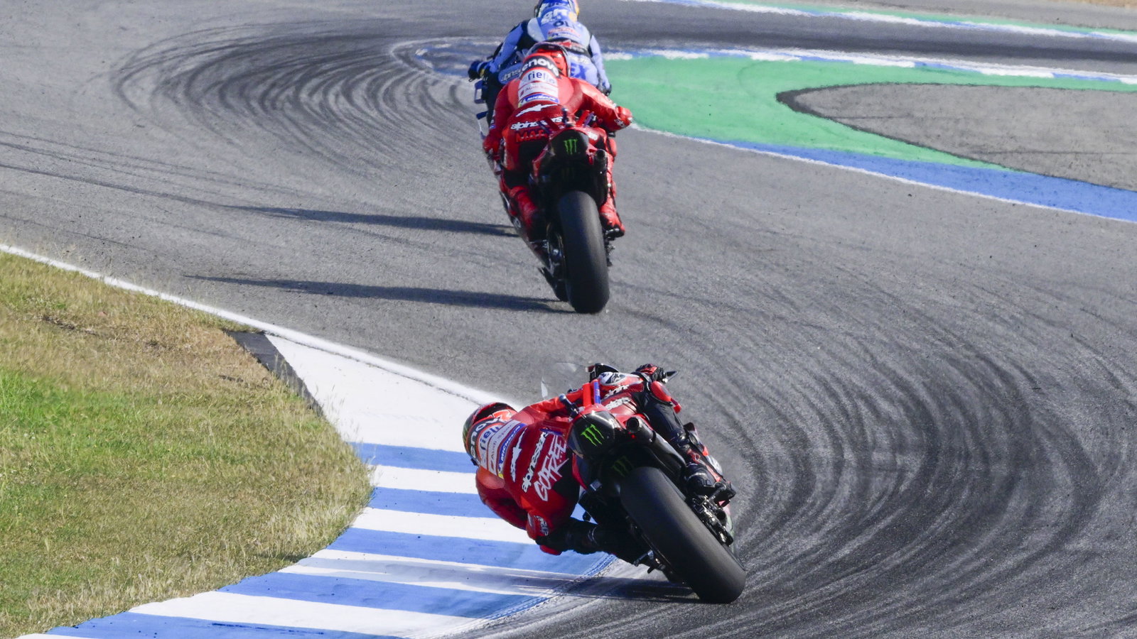 Francesco Bagnaia chases Marc Marquez, 2025 MotoGP Thai Grand Prix. Credit: Gold and Goose.