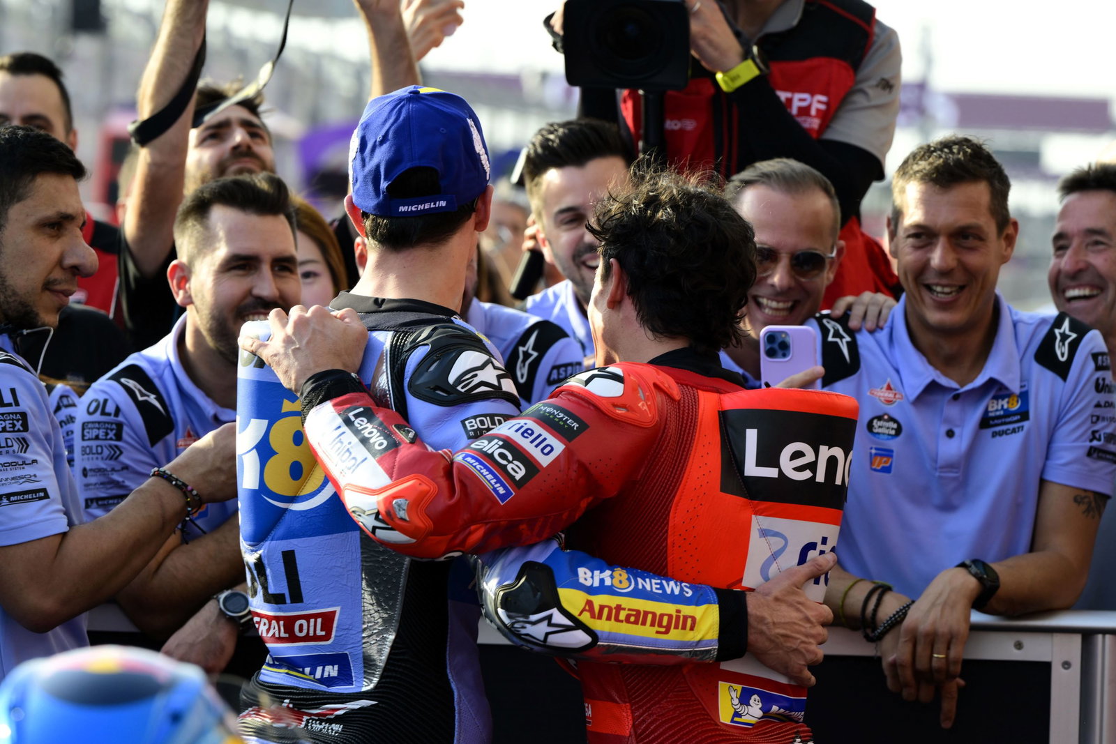 Alex Marquez puts sticker on Marc's back, 2025 Qatar MotoGP qualifying
