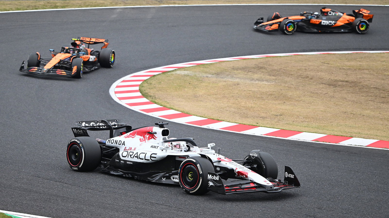 Verstappen held off both McLarens to win in Japan