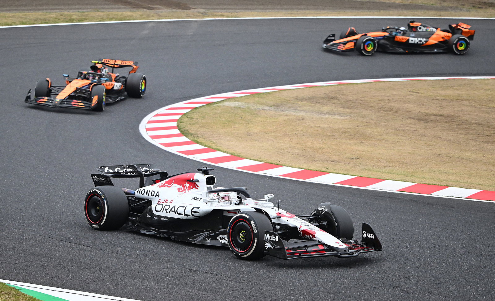 Verstappen held off both McLarens to win in Japan