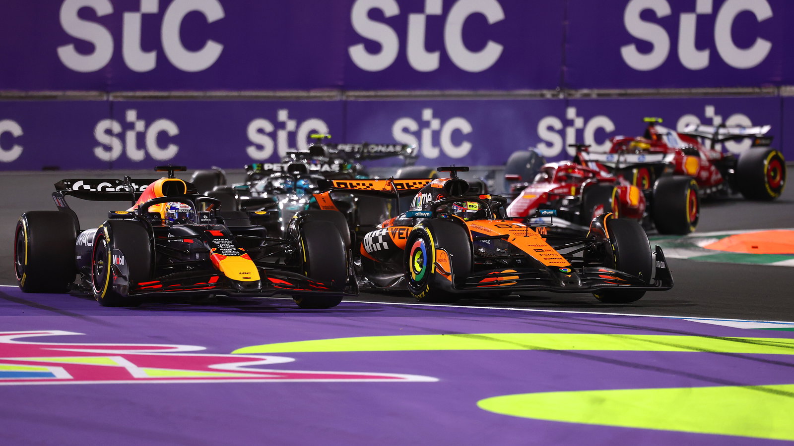 Verstappen and Piastri go wheel-to-wheel at the start 