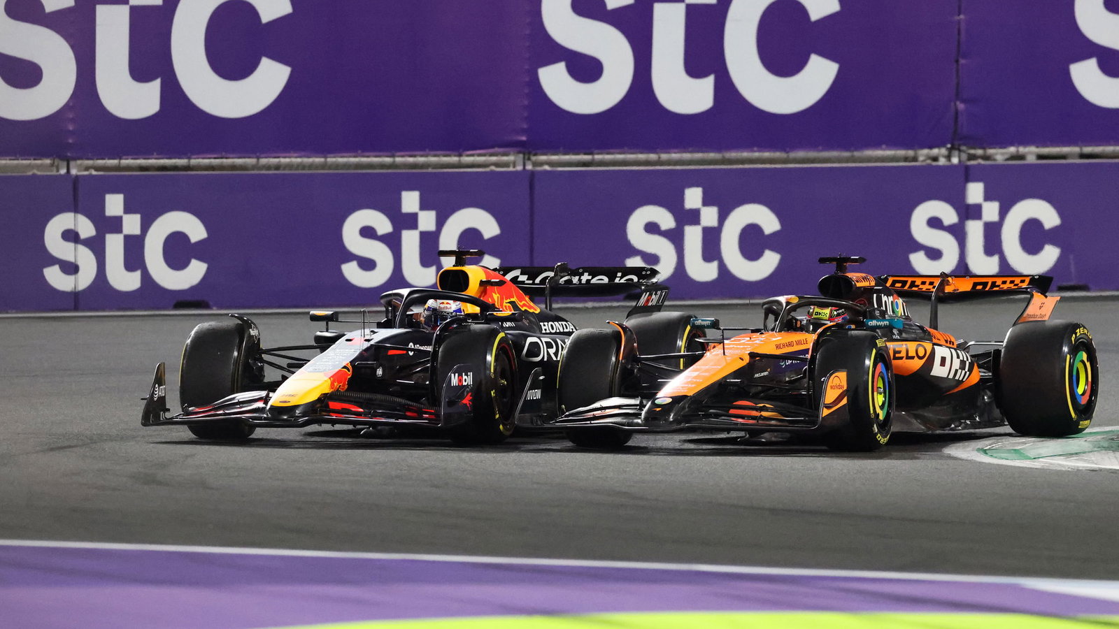 Max Verstappen and Oscar Piastri battle at the start of the race