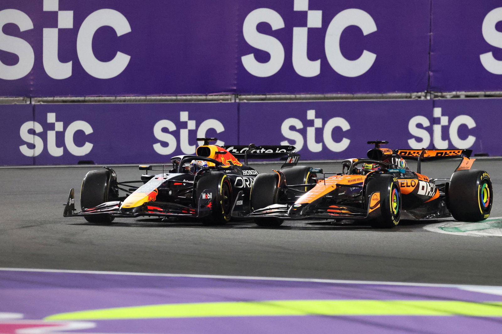 Max Verstappen and Oscar Piastri battle at the start of the race