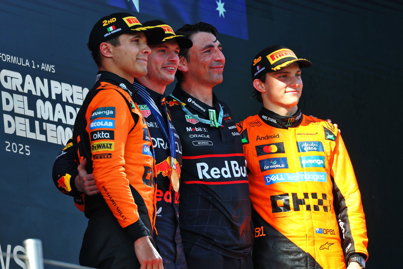 Max Verstappen and the two McLaren drivers on the Imola podium
