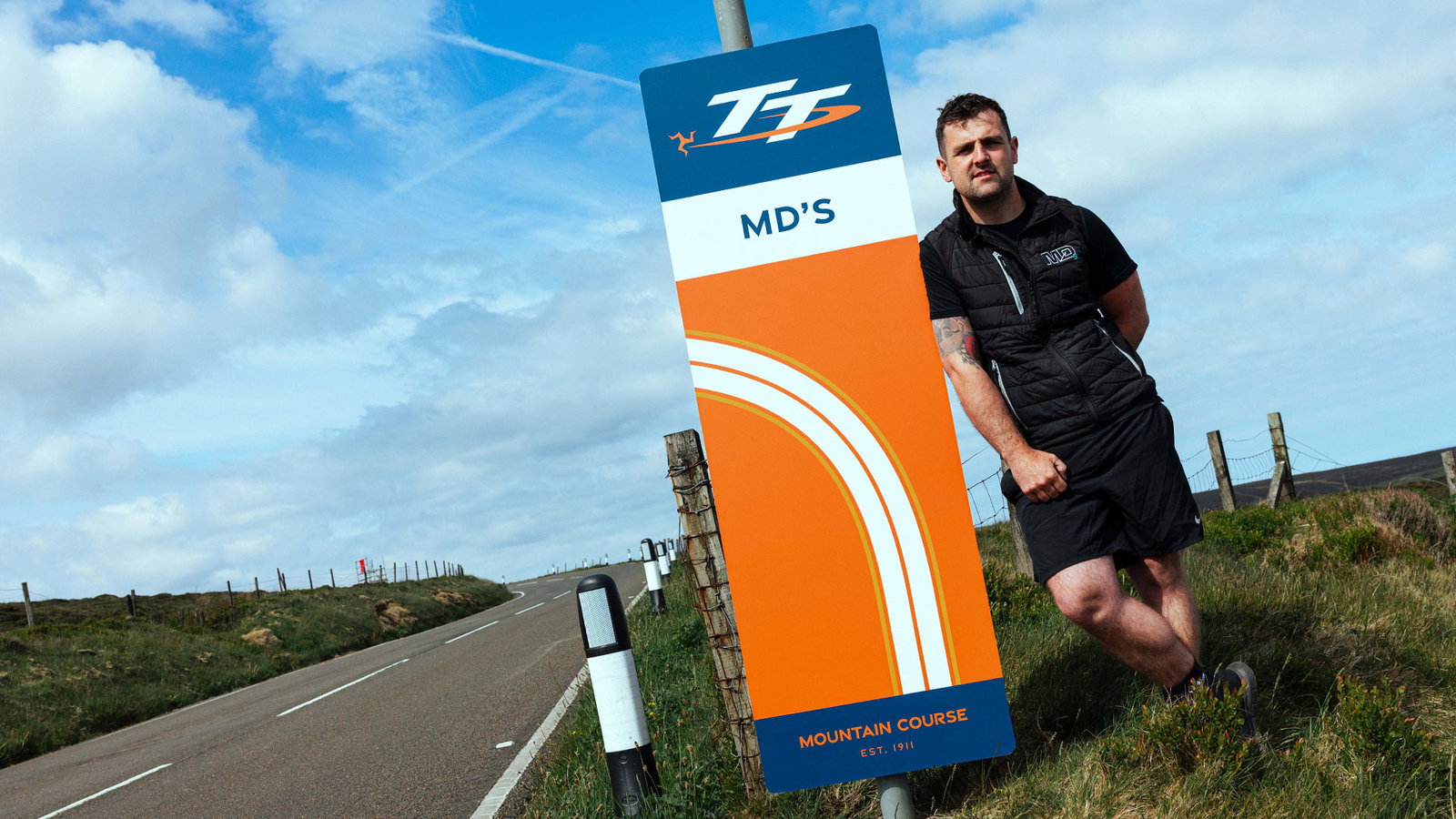 Michael Dunlop with "MD's" corner sign. Credit: Isle of Man TT.