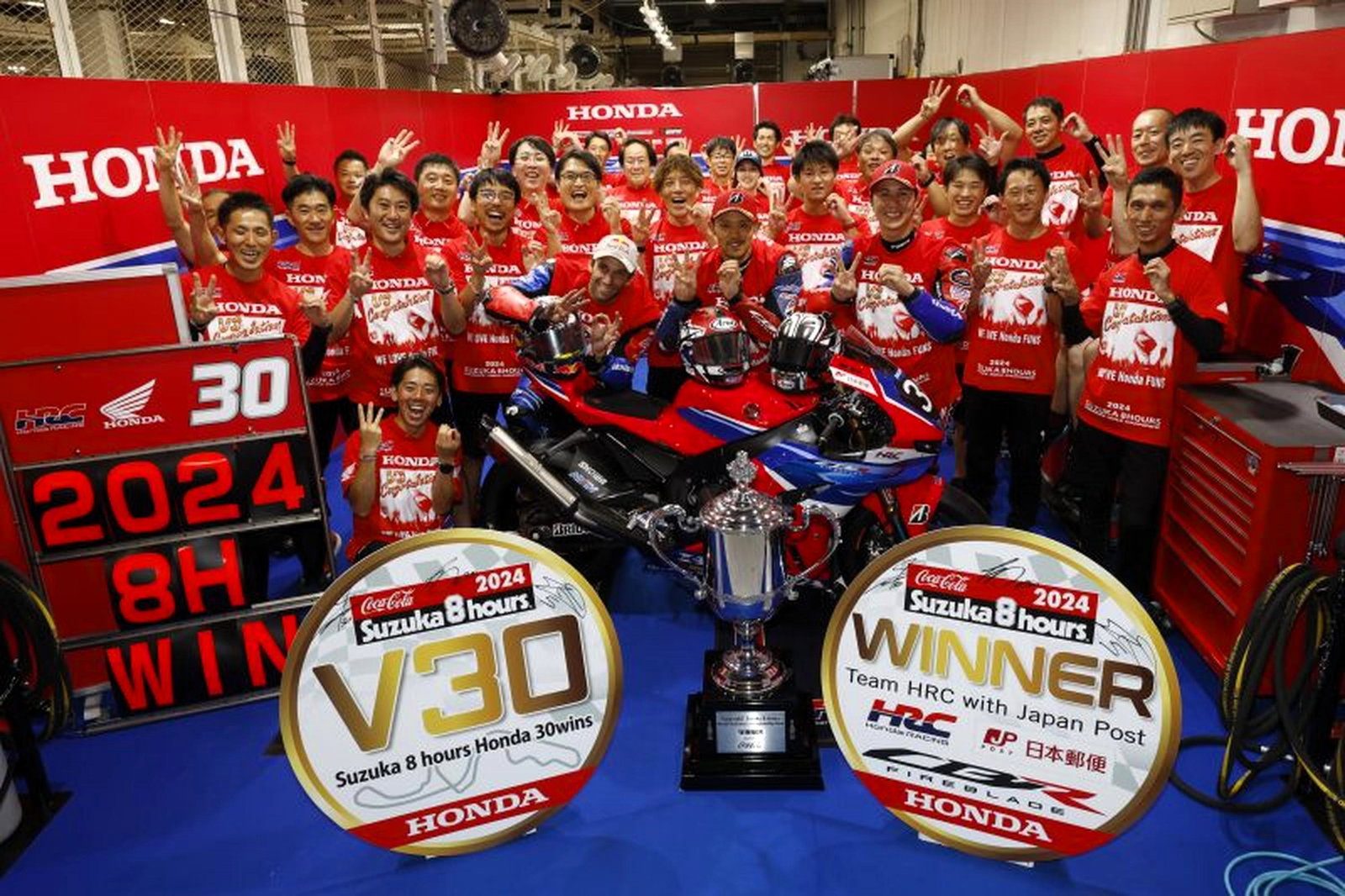 Johann Zarco celebrates 2024 Suzuka victory with Takumi Takahashi and Teppei Nagoe.