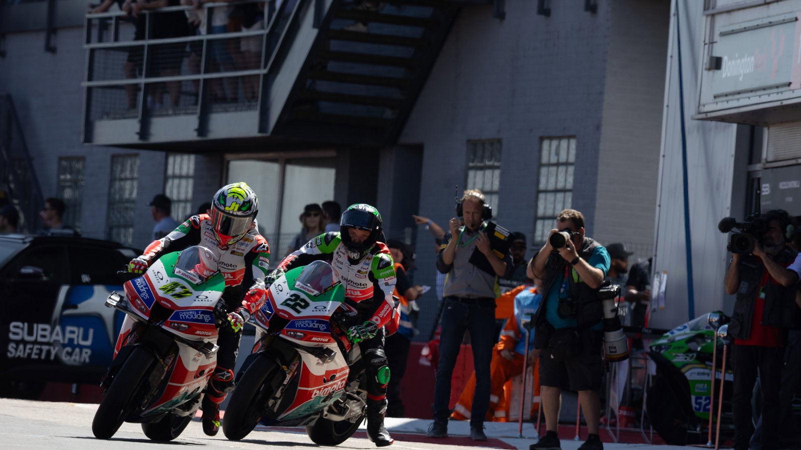 Axel Bassani, Alex Lowes, 2025 UK WorldSBK, pit lane. Credit: Gold and Goose.