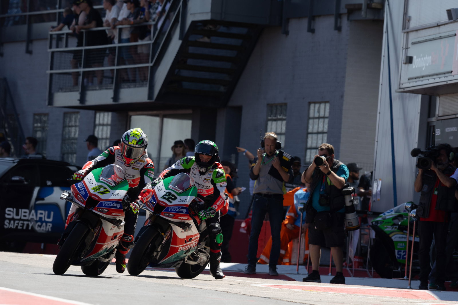 Axel Bassani, Alex Lowes, 2025 UK WorldSBK, pit lane. Credit: Gold and Goose.