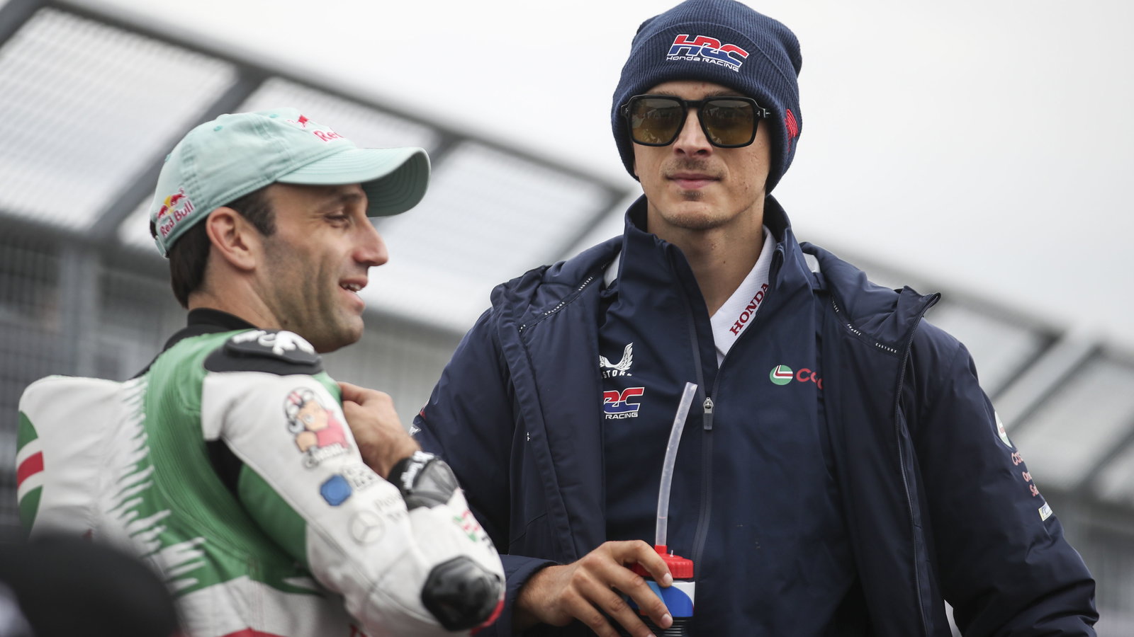 Johann Zarco, Luca Marini, 2025 MotoGP German Grand Prix, pit lane. Credit: Gold and Goose.