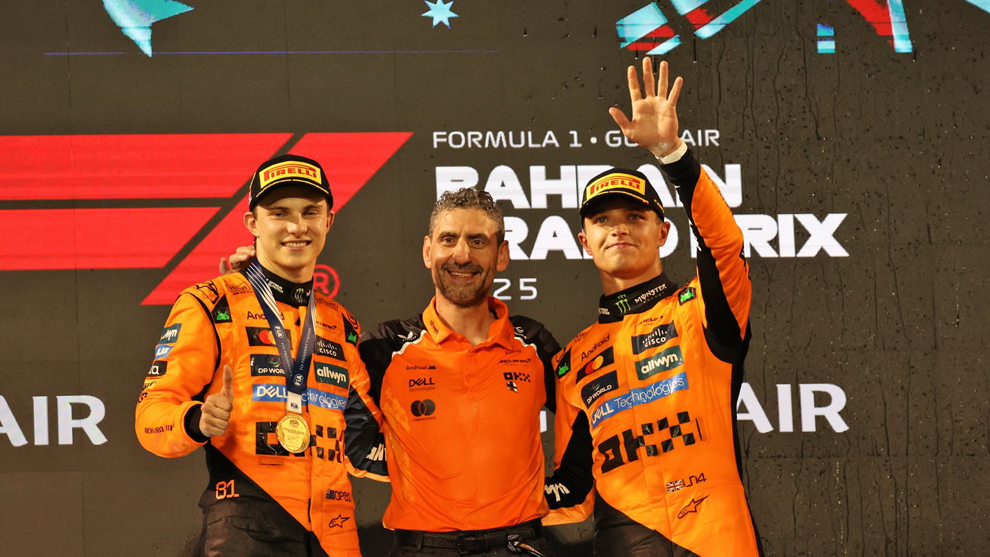 Lando Norris and Oscar Piastri with Andrea Stella