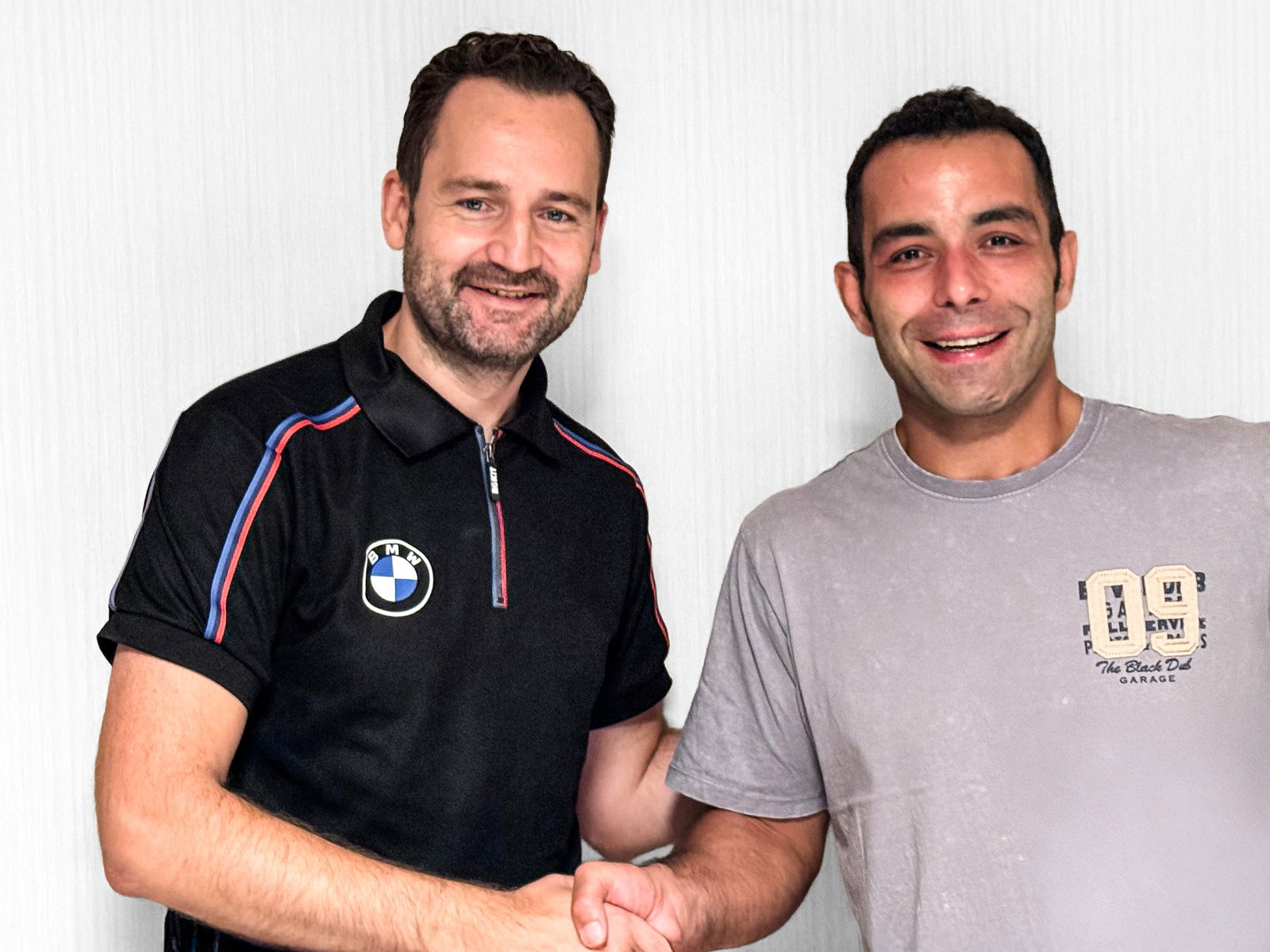Sven Blusch shakes hands with Danilo Petrucci. Credit: BMW.