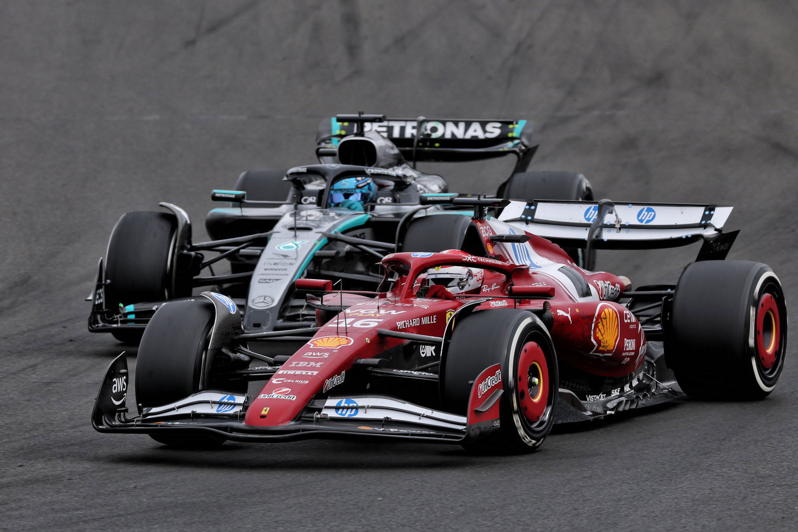 Charles Leclerc battles George Russell 