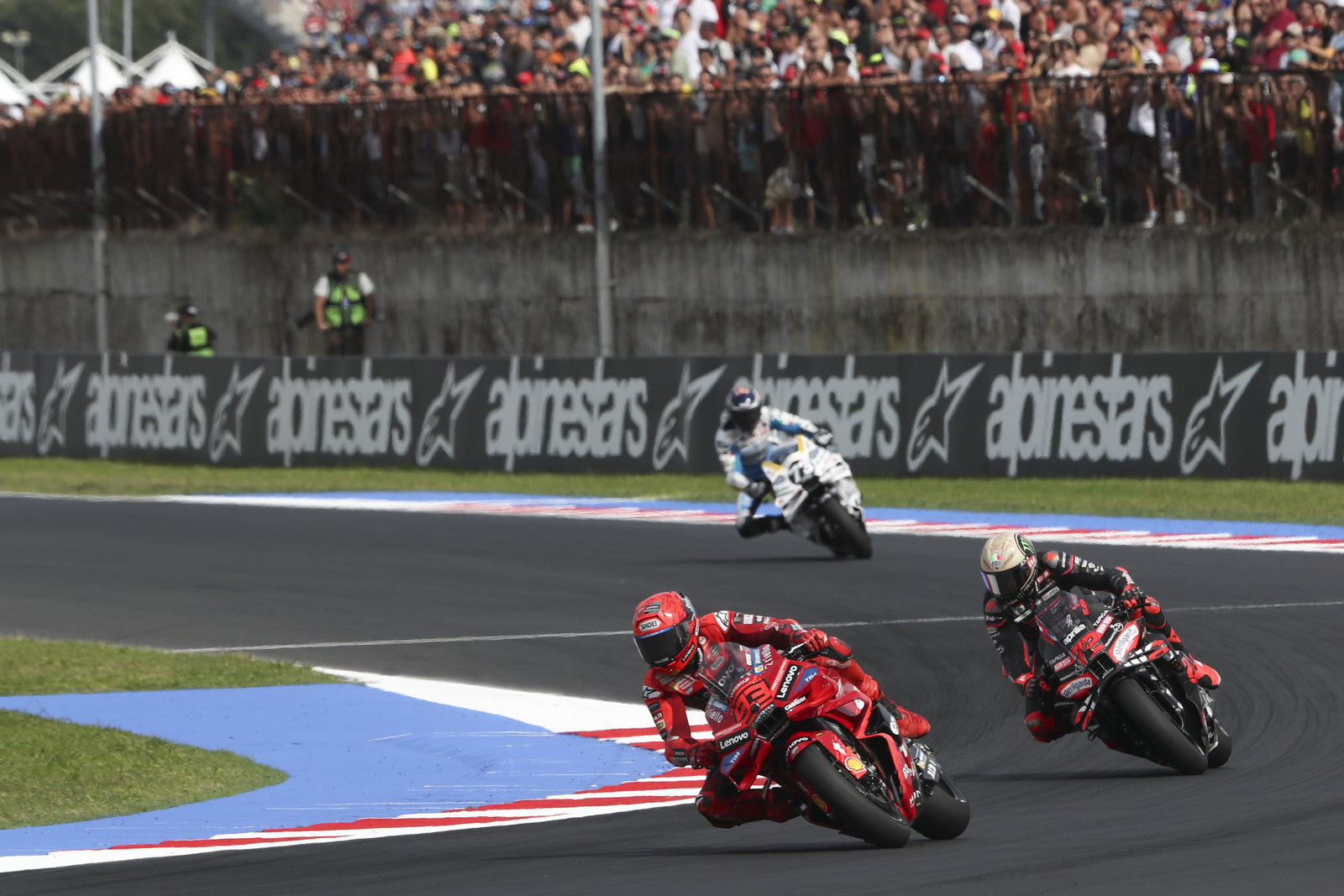 Marc Marquez leads Marco Bezzecchi, Alex Marquez, 2025 MotoGP San Marino Grand Prix. Credit: Gold and Goose.