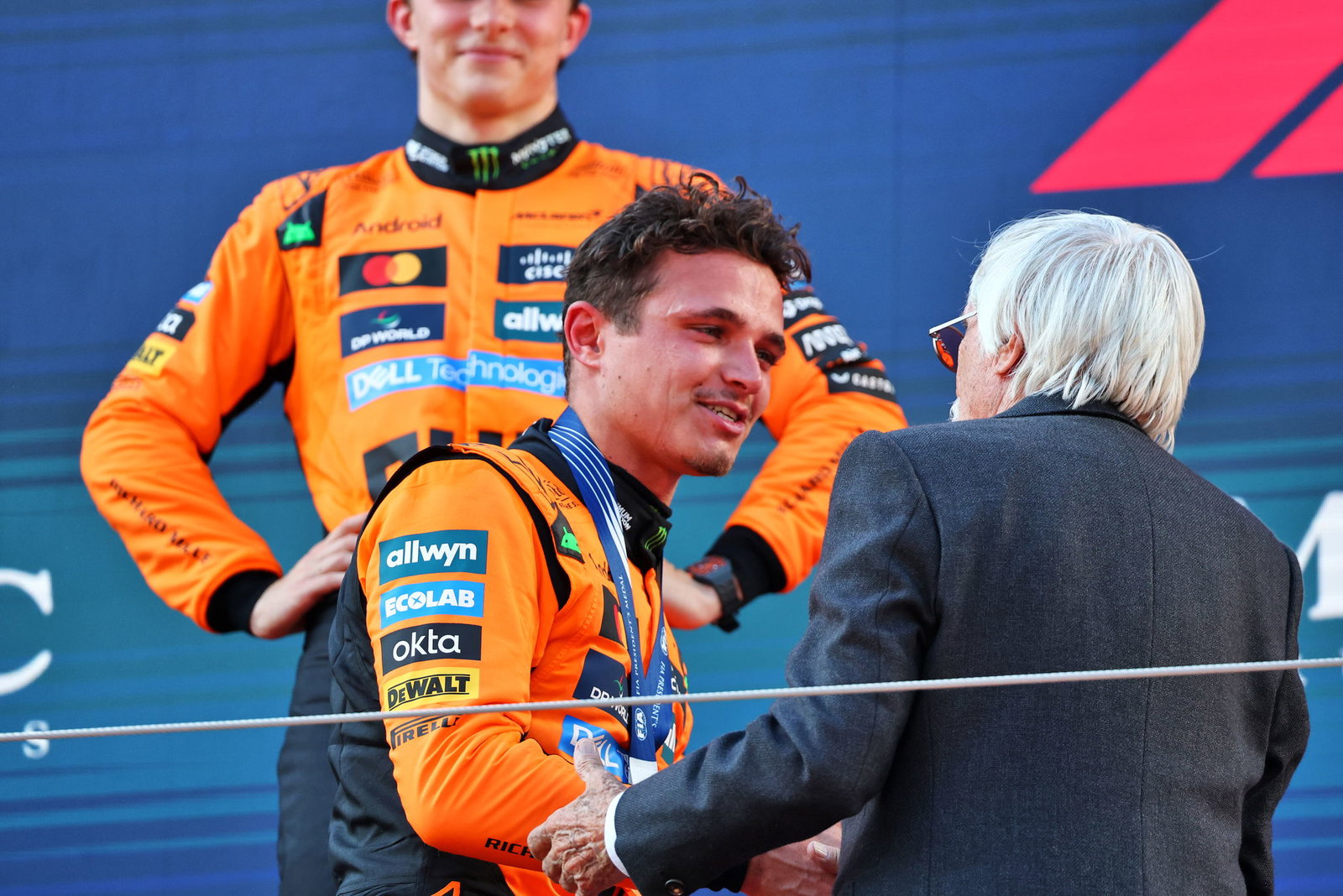 Bernie Ecclestone and Lando Norris on the podium 