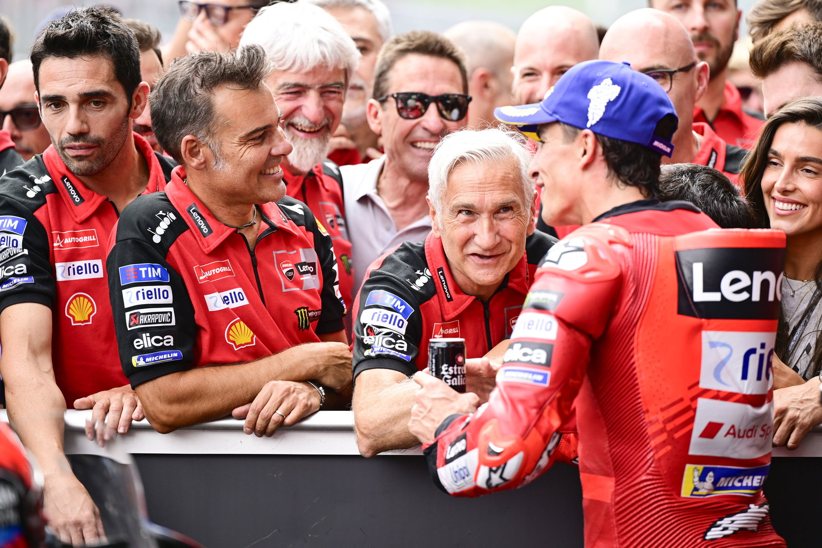 Marc Marquez speaks with Davide Tardozzi, Marco Rigamonti, 2025 MotoGP Austrian Grand Prix, parc ferme. Credit: Gold and Goose.