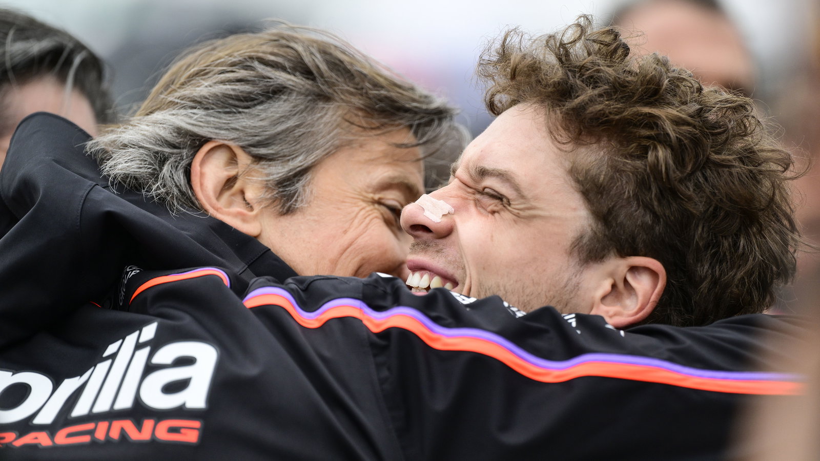 Massimo Rivola and Marco Bezzecchi embrace, 2025 MotoGP Valencia Grand Prix, Sprint post-race. Credit: Gold and Goose.