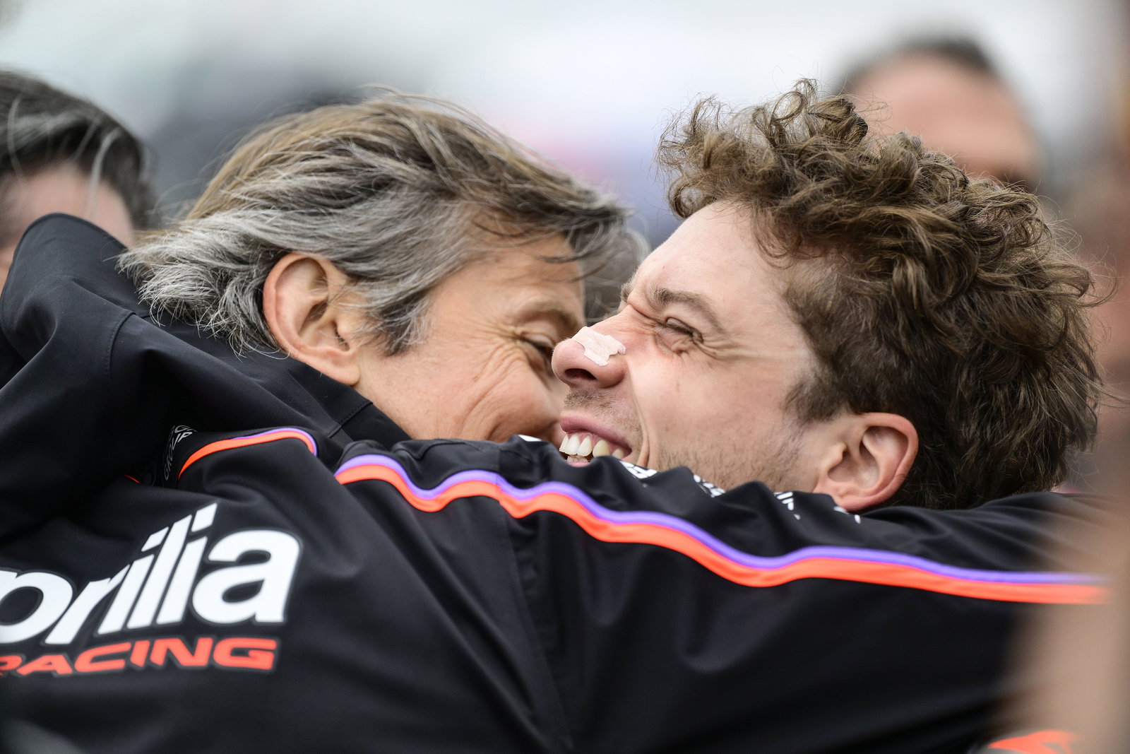Massimo Rivola and Marco Bezzecchi embrace, 2025 MotoGP Valencia Grand Prix, Sprint post-race. Credit: Gold and Goose.