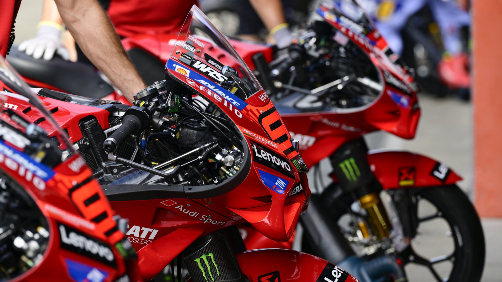 Marc Marquez, Pecco Bagnaia Ducati Desmosedici GP25s, 2025 MotoGP Japanese Grand Prix, pit lane. Credit: Gold and Goose.