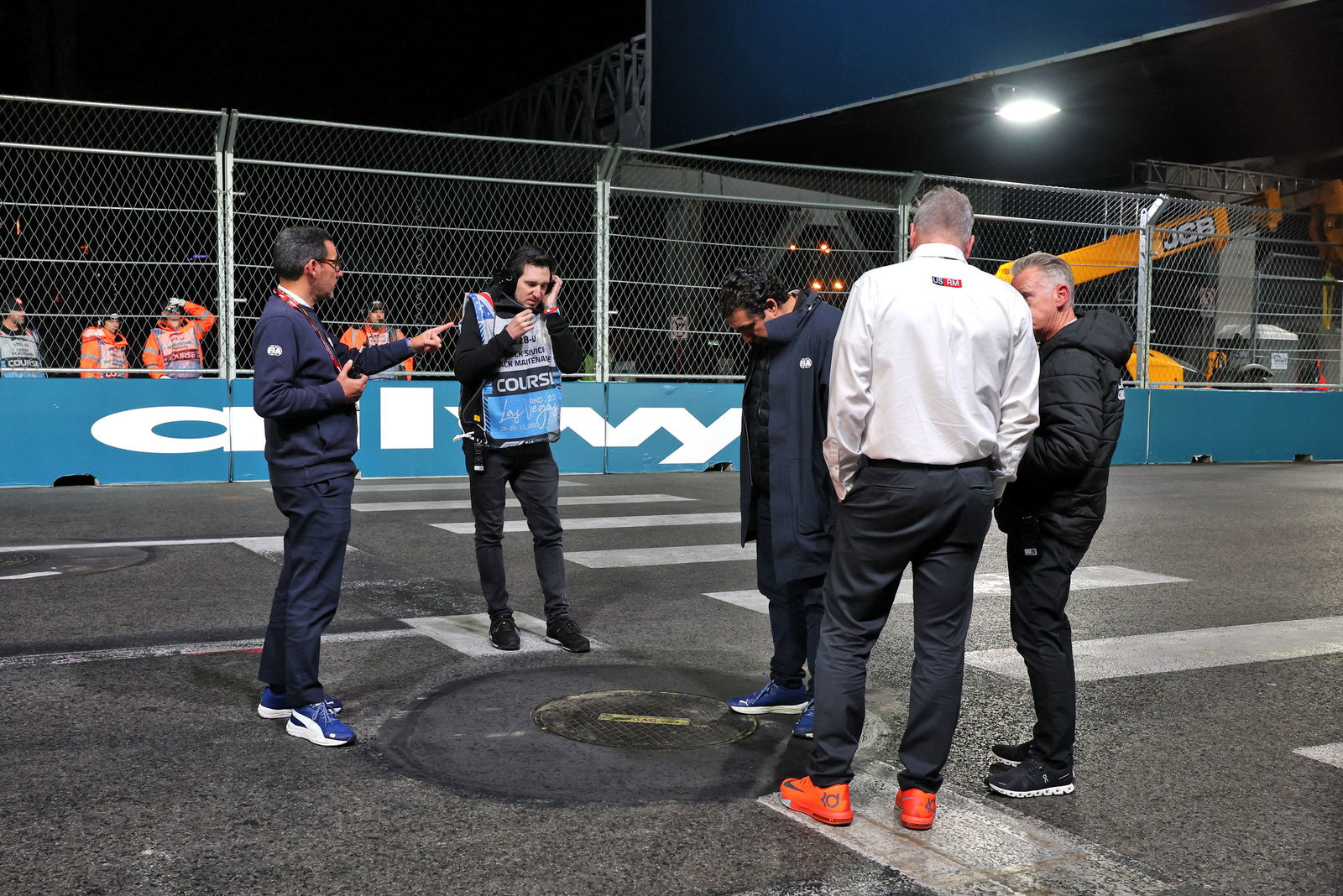 FIA race director Rui Marques inspects a drain cover