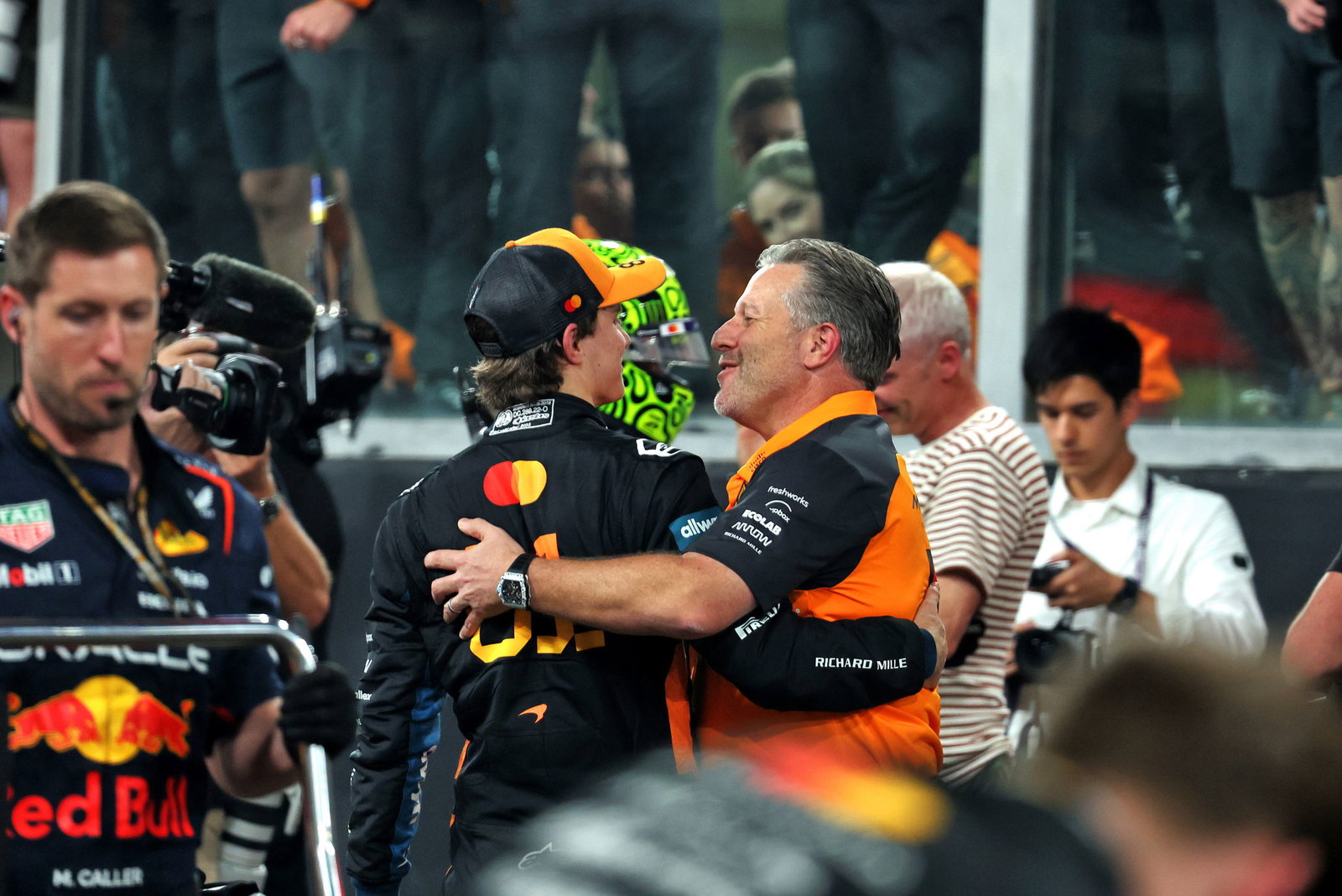 Brown embraces Piastri after the Abu Dhabi GP