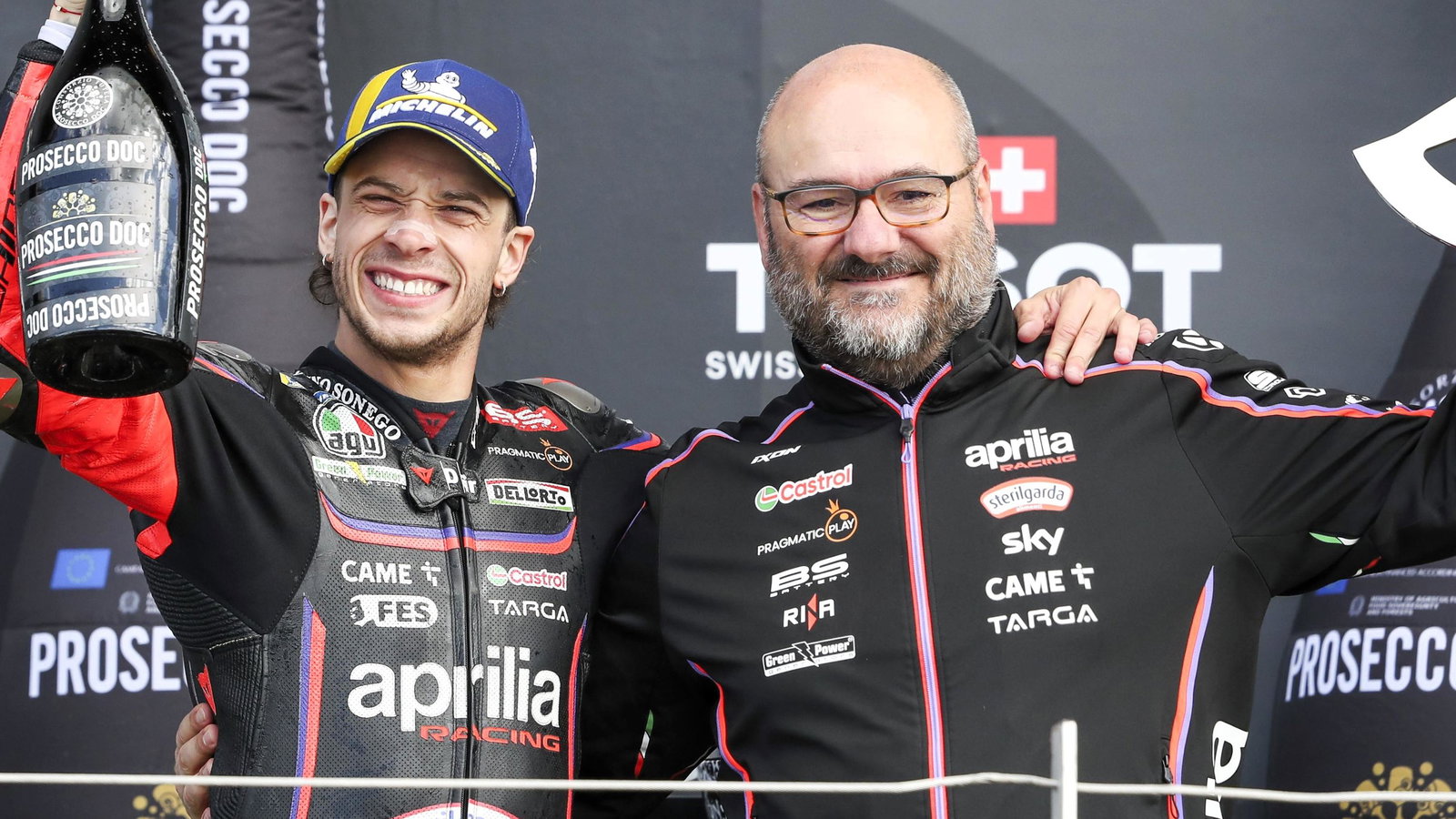 Marco Bezzecchi and Fabiano Sterlacchini celebrate a 2025 MotoGP victory.