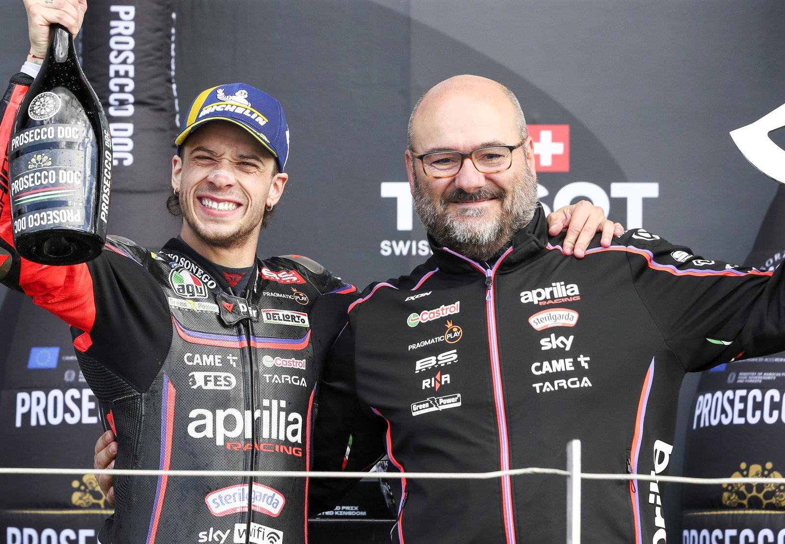 Marco Bezzecchi and Fabiano Sterlacchini celebrate a 2025 MotoGP victory.