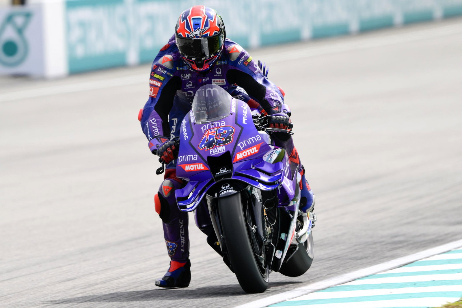 Jack Miller with his rear wheel in the air under braking on the Inline M1.