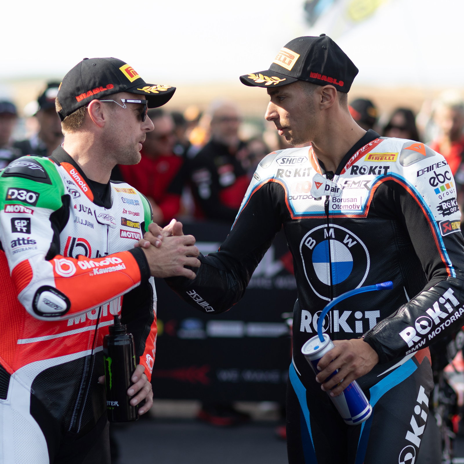 Alex Lowes and Toprak Razgatlioglu in parc ferme at 2025 French WorldSBK. Credit: Gold and Goose.
