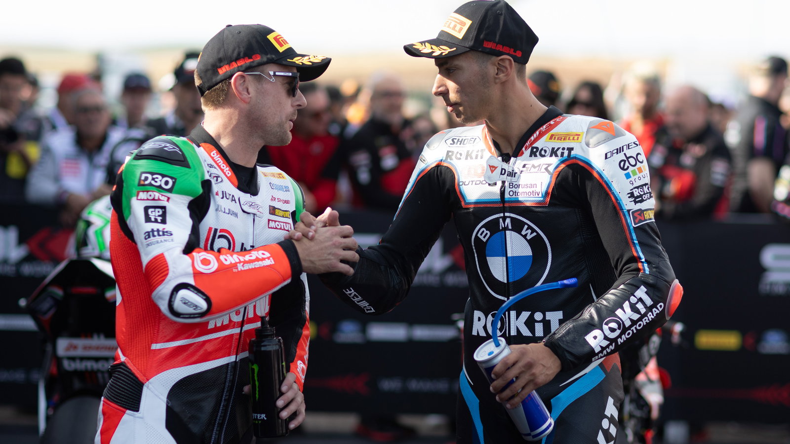 Alex Lowes and Toprak Razgatlioglu in parc ferme at 2025 French WorldSBK. Credit: Gold and Goose.