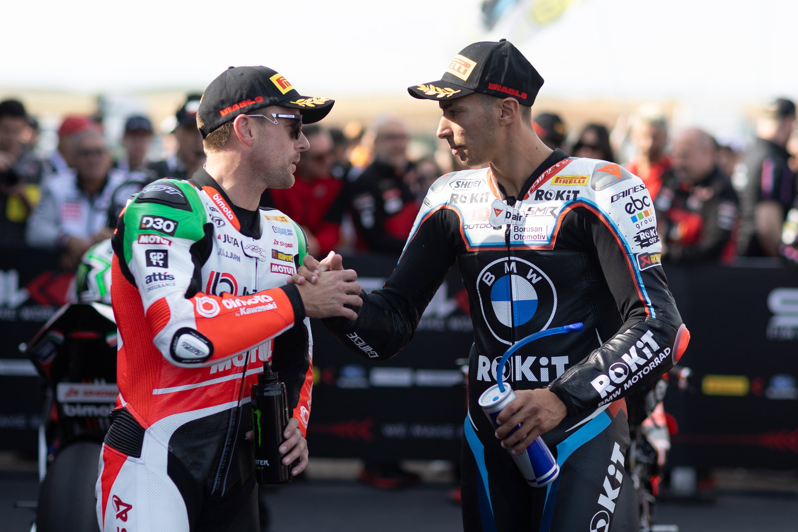 Alex Lowes and Toprak Razgatlioglu in parc ferme at 2025 French WorldSBK. Credit: Gold and Goose.
