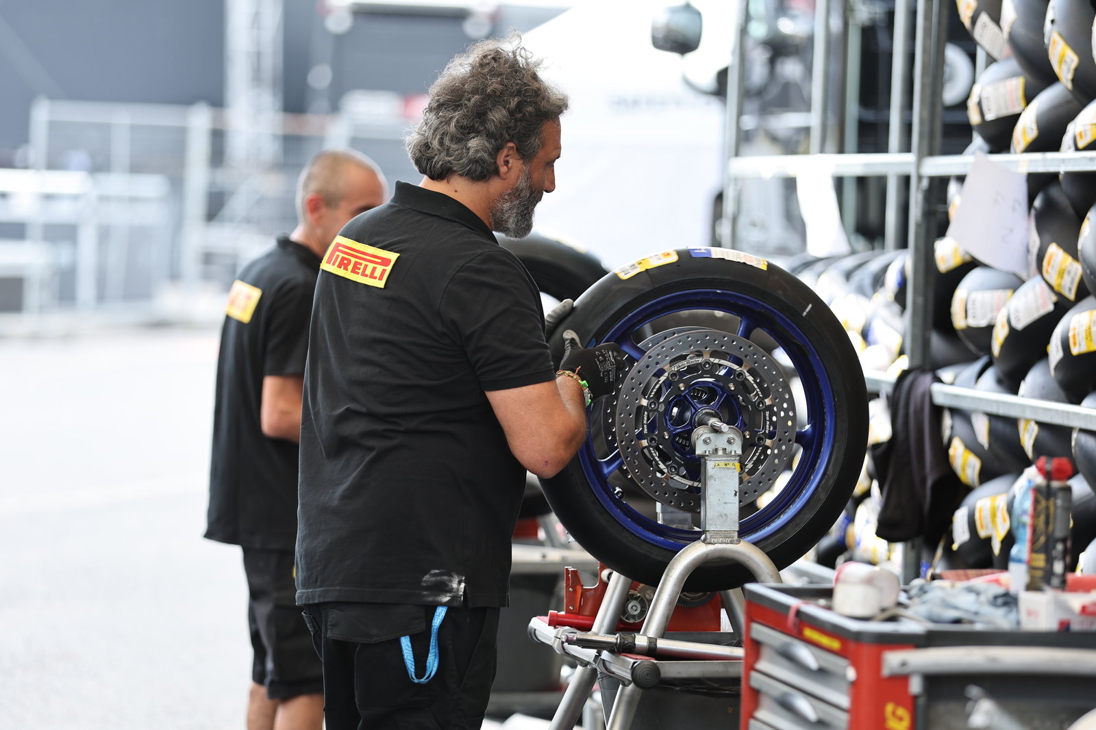 Pirelli tyre fitter, 2024 Czech WorldSBK. Credit: Gold and Goose.