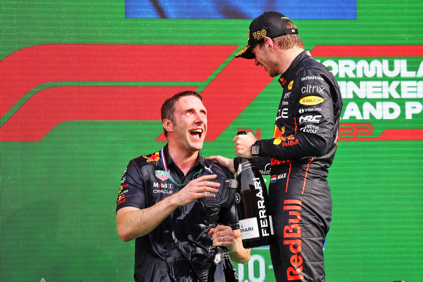 Craig Skinner and Max Verstappen on the F1 podium 