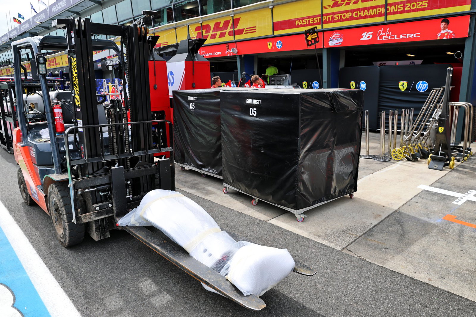 Ferrari's freight is unloaded in the Melbourne pit lane