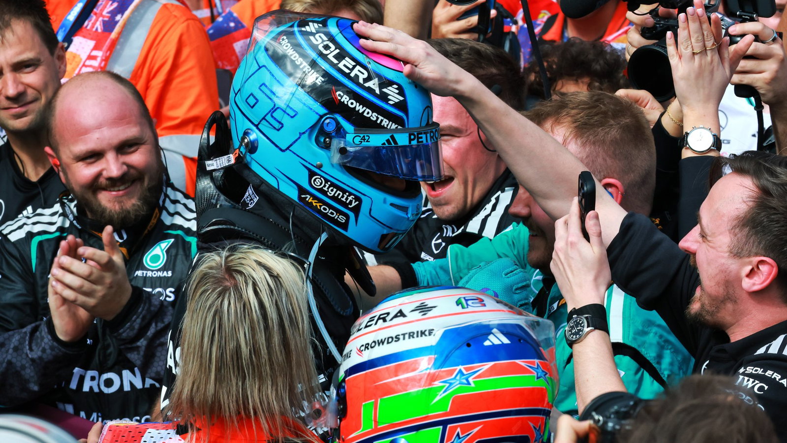 George Russell celebrates his victory 