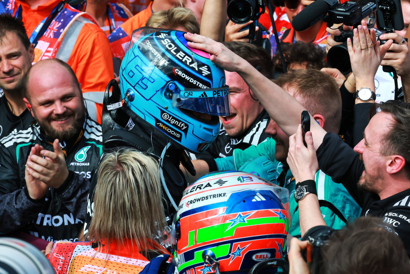 George Russell celebrates his victory 